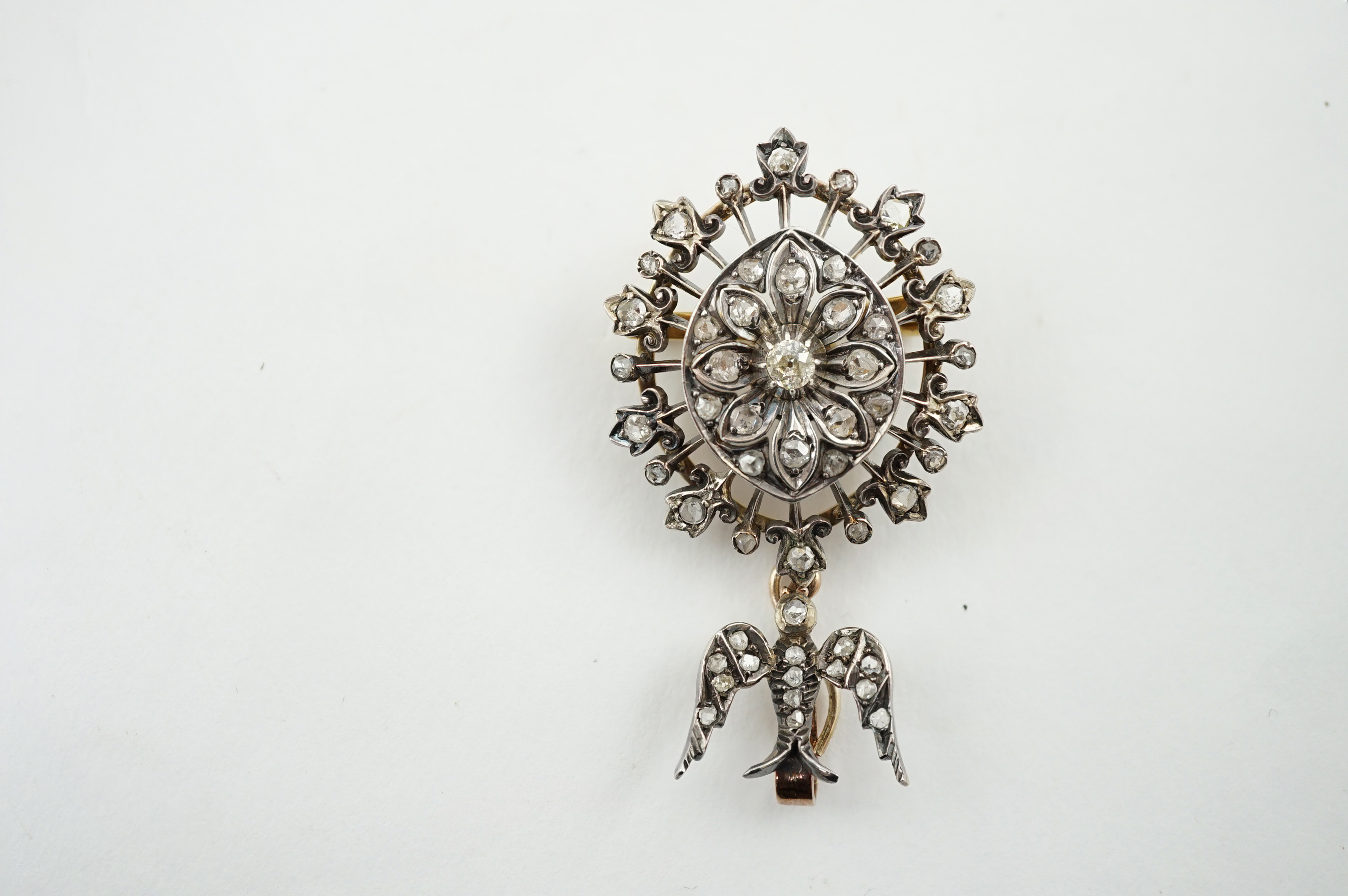 A Victorian gold, silver and diamond cluster set drop pendant brooch